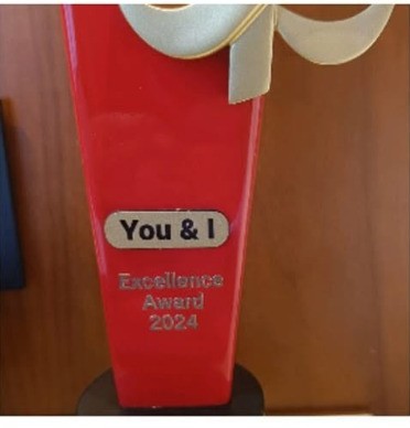 Close-up of the Kotak Mutual Fund You & I Excellence Award 2024 trophy